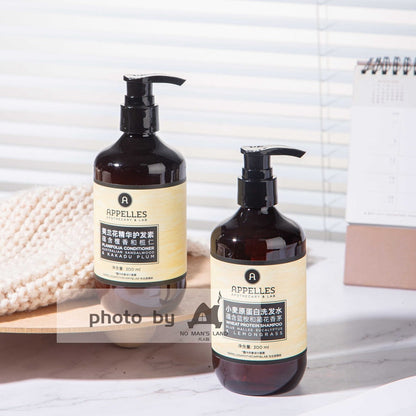 two bottles of APPELLES Langham hotel shampoo and conditioner.
